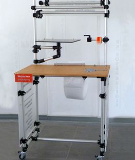 Image shows mobile workstation made from plastic tube connectors