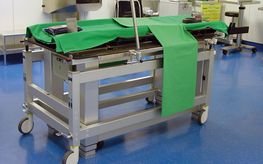 Image shows a height-adjustable operating table