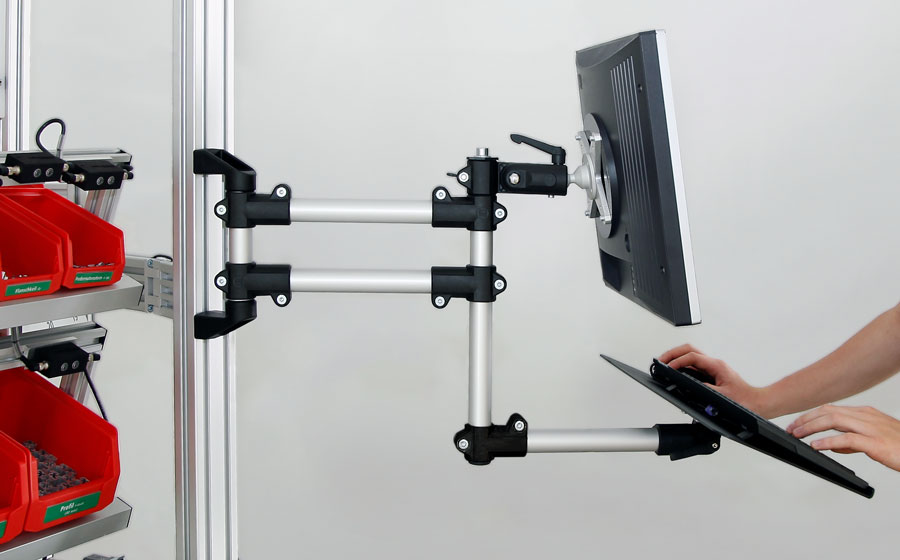 Example attachment of a support arm with keyboard shelf